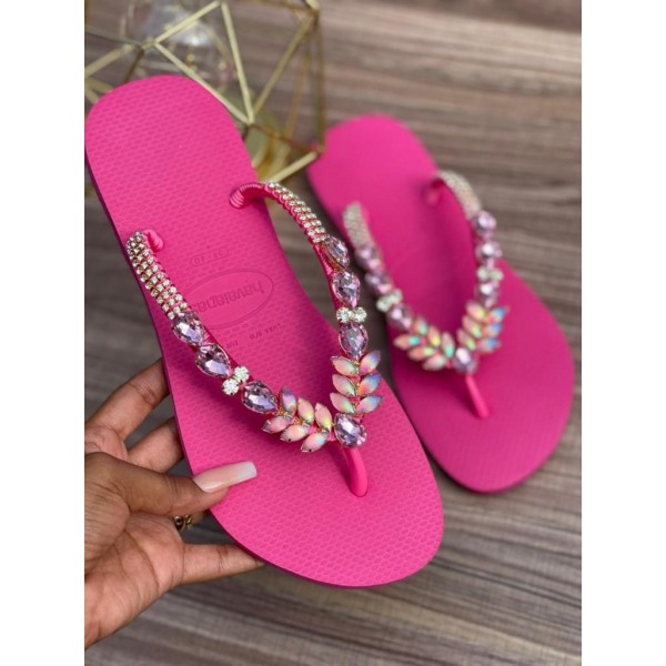 Fuchsia women slippers decorated with different colored stones