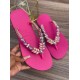 Fuchsia women slippers decorated with different colored stones