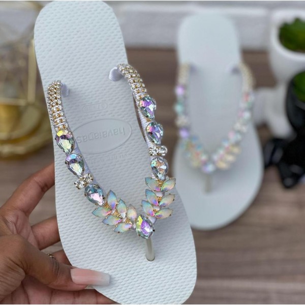 White women slippers decorated with distinctive stones