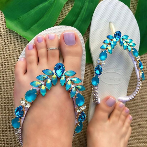 White women slippers decorated with wonderful blue stones
