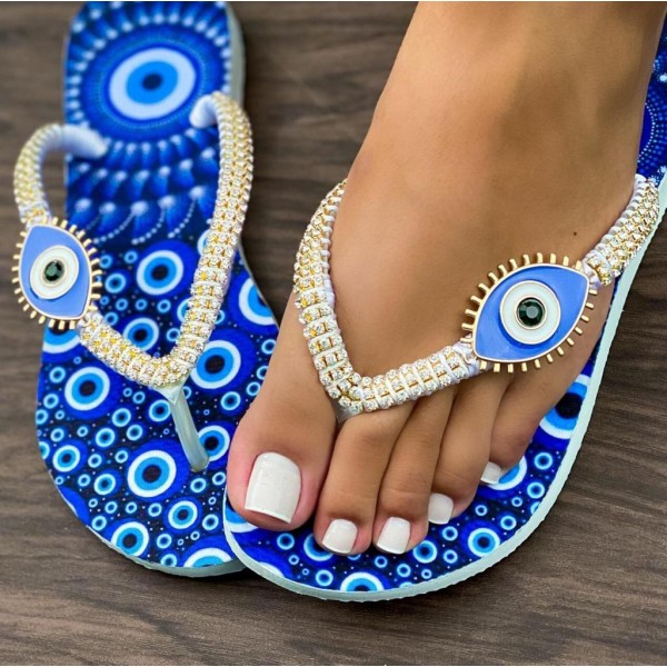 Blue slippers for women decorated with a stone eye